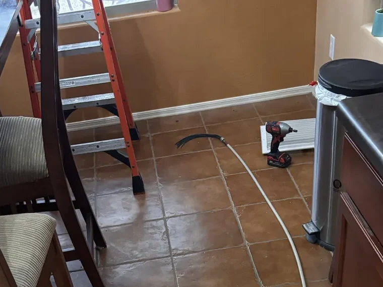 Air duct cleaning in progress at a supply register