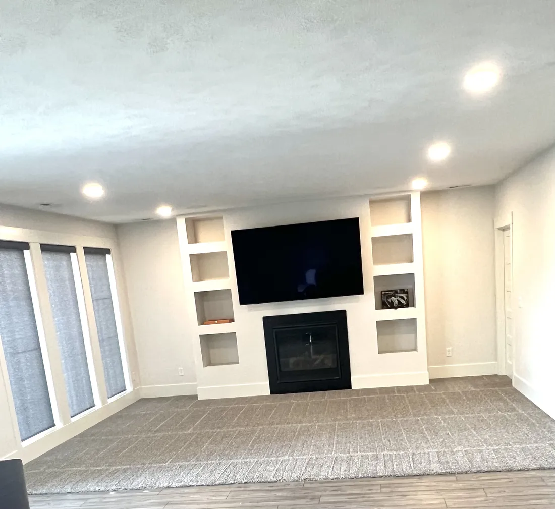 Living room carpet in clean rows in front of a fireplace wall, listing-ready carpet cleaning in the Phoenix area