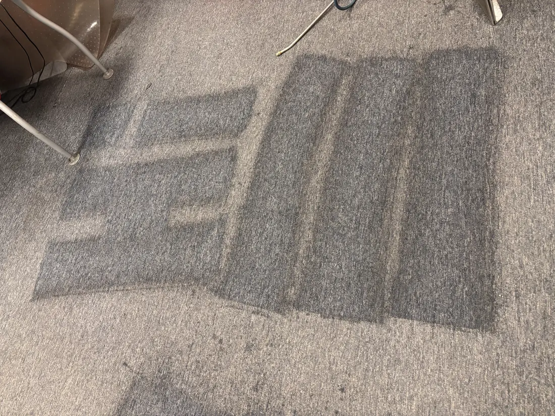 Office carpet mid-cleaning after hours