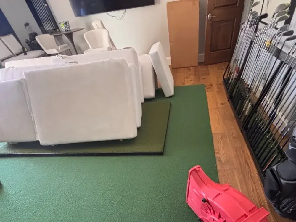 Cushions set out with an air mover running to speed drying after cleaning