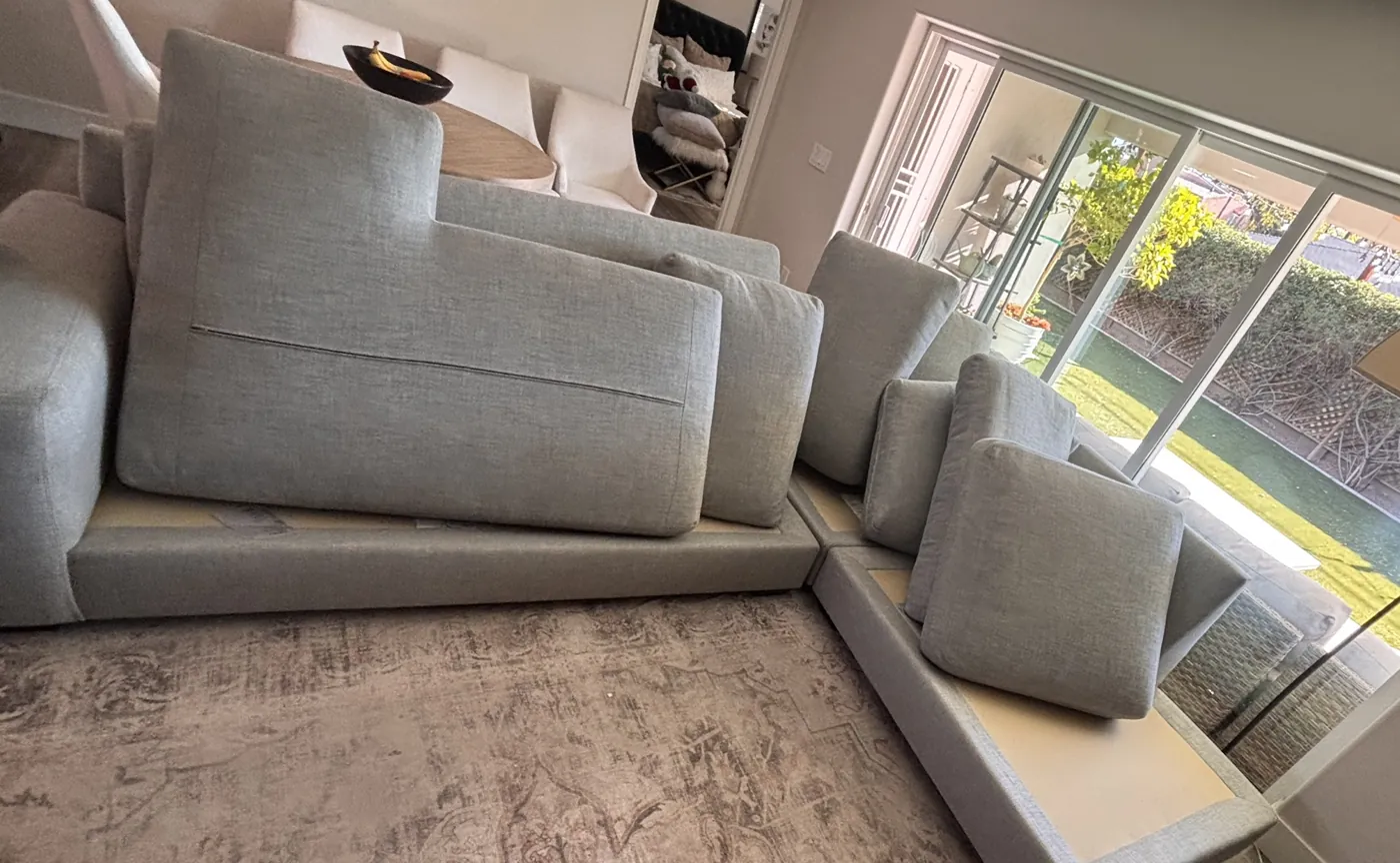 Grey L-shaped sectional cleaned, cushions drying