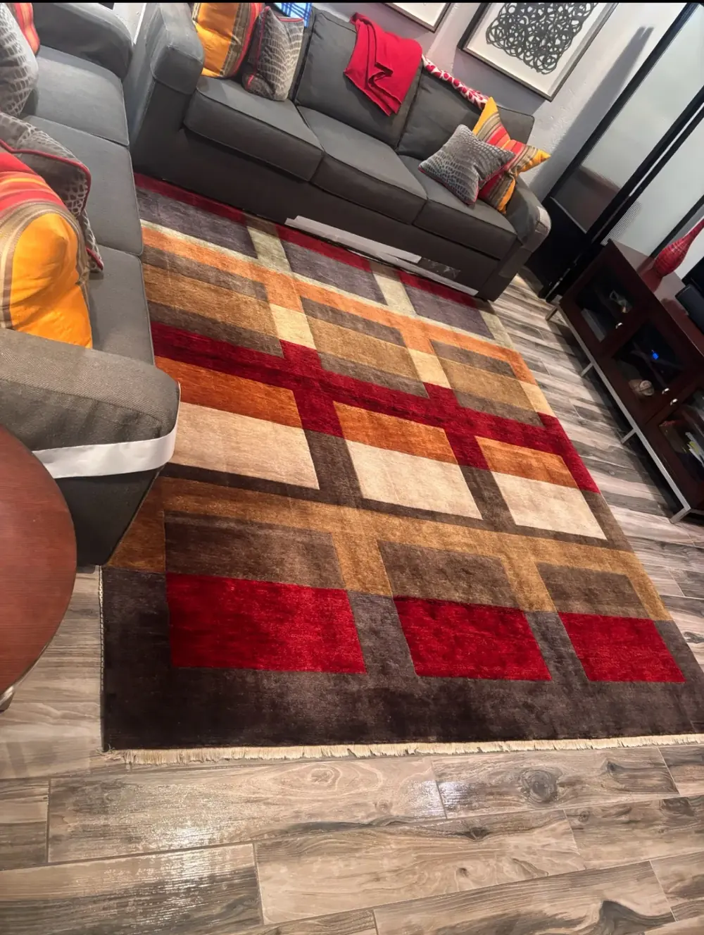 Hand-knotted wool rug with fringe, cleaned and laid back in place