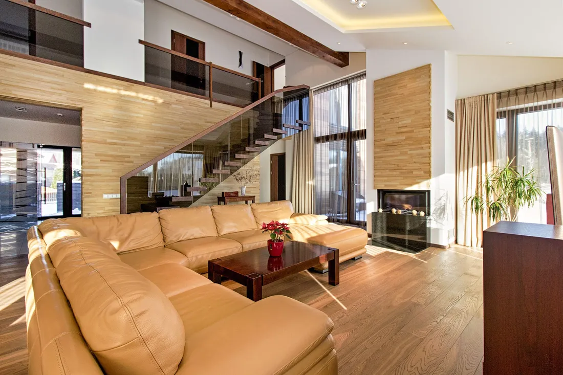 Tan leather sectional with a chaise in a bright living room, leather couch and furniture cleaning in Apache Junction AZ