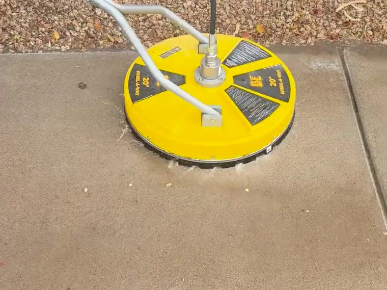 Twenty inch surface cleaner working a concrete walkway for an even finish