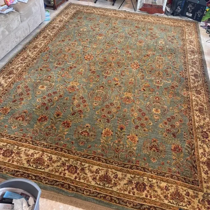 Traditional bordered wool rug after cleaning