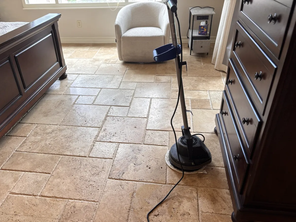 Travertine floor being machine cleaned