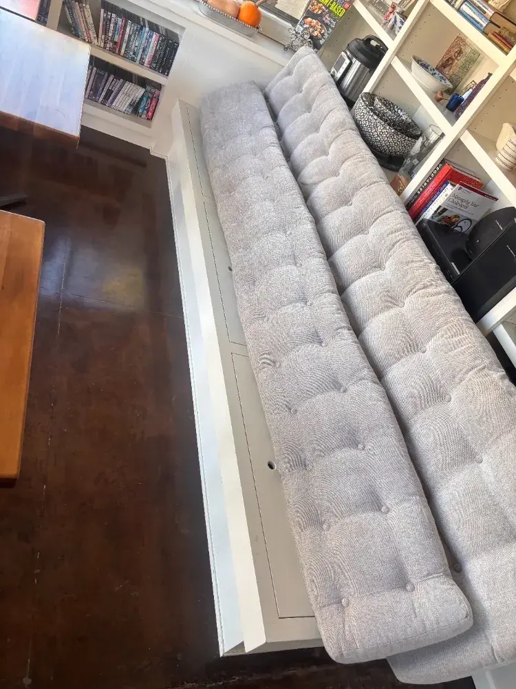 Tufted bench cushions cleaned, with the buttons and seams detailed by hand