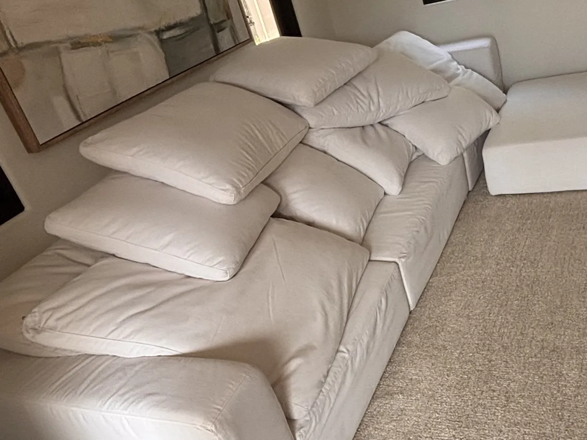 White sectional cleaned, cushions drying