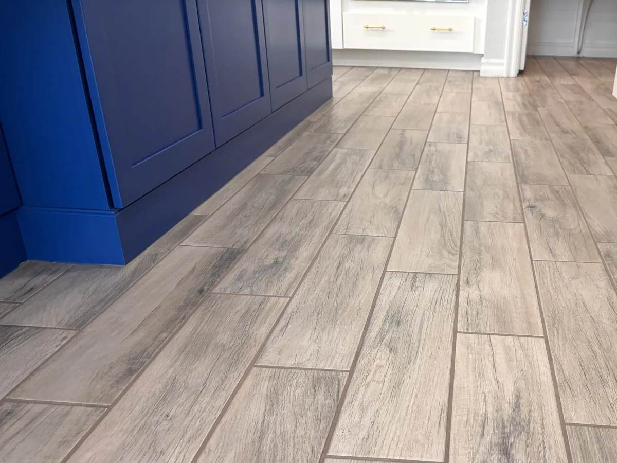 Wood-look tile kitchen with the grout color sealed